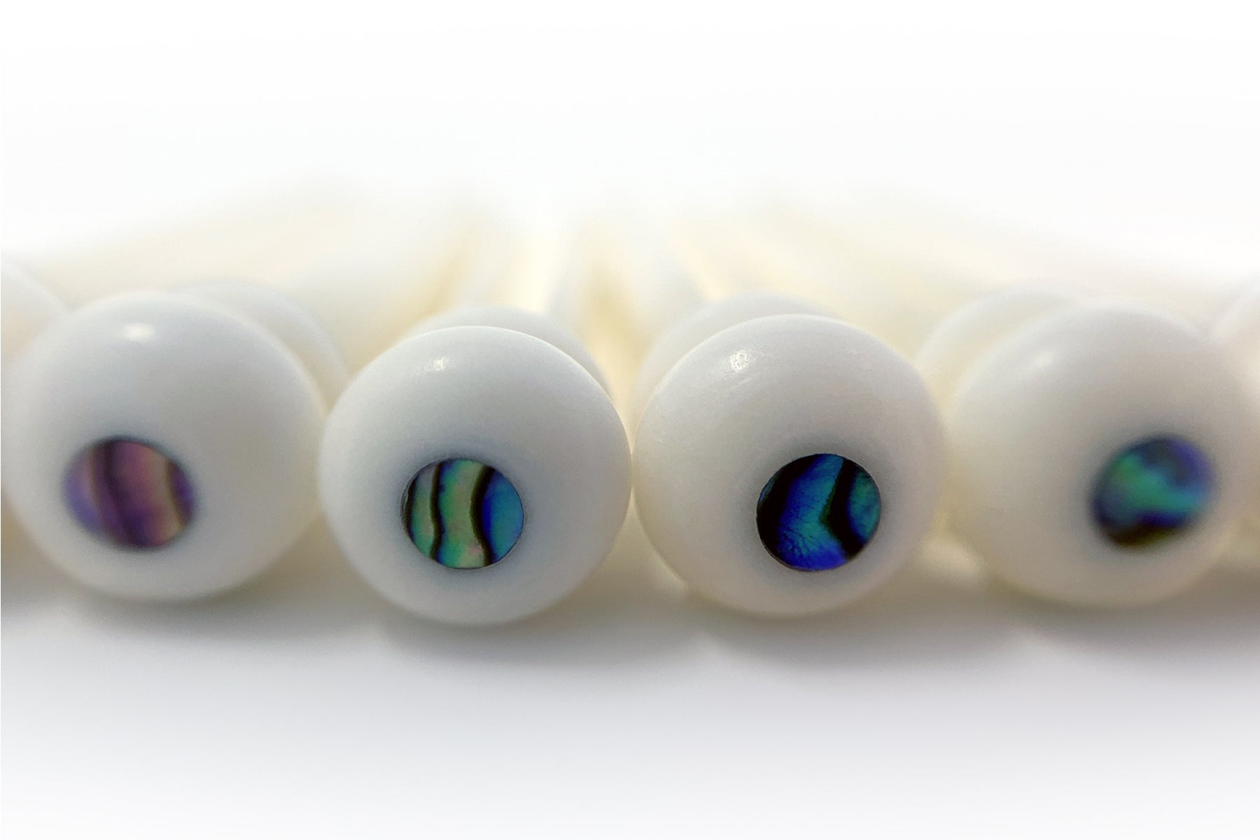 The Impact of Bridge Pin Materials on Guitar Tone – Crosby